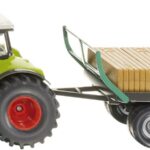 CLAAS avec fourches et remorque à balles